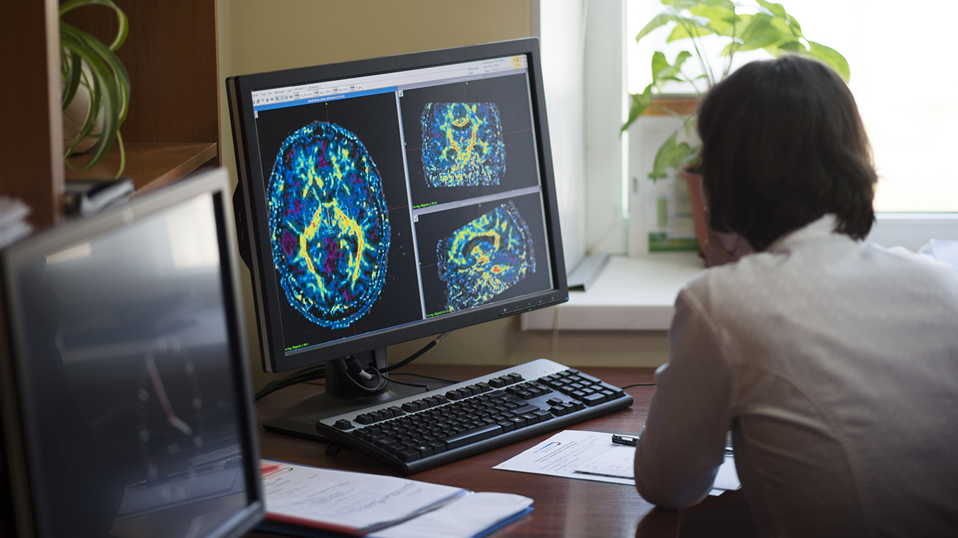 doctor-looking-at-brain-injury-x-ray-scna-imaging